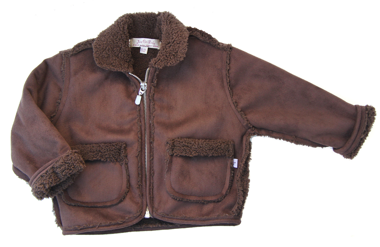 Boys favorite aviator jacket in super soft suede and fleece, has slightly longer sleeves so they can be rolled up or left down. Tone on tone suede and fleece in coffee brown, or two tone charcoal black suede with dove grey fleece. Faux zipper, along with two front pockets keep winter hands cozy and warm. Machine wash cold, line dry Made in the USA