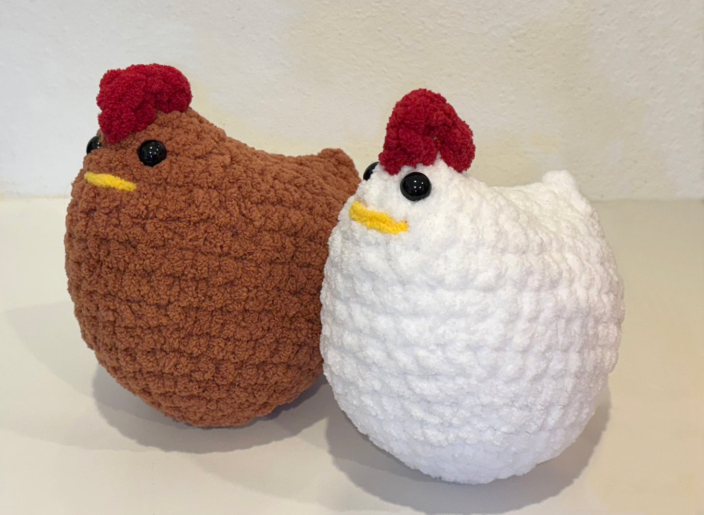 Cutest crochet plushie chicken collectibles are hand crocheted by Anya, MarVia Square's youngest artisan. Made with the softest, plush acrylic yarn, and black mushroom bead (plastic) buttons for the eyes. Colors: Barn Brown & Eggshell White Dimensions: 8" Long, 6" High Spot treat with mild soap or dry clean Consciously made in California