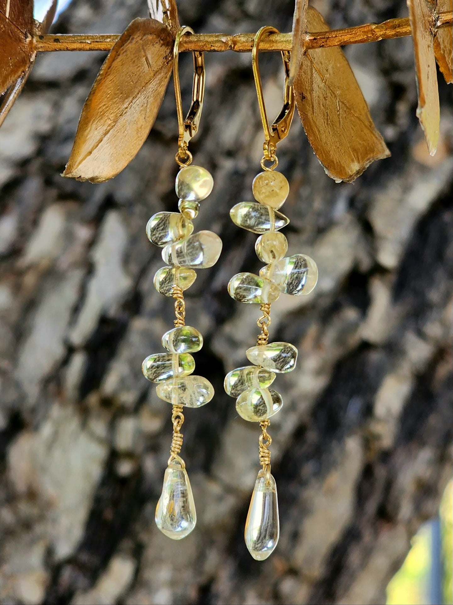 Boost your well being in these gorgeous gemstone drop earrings with healing properties of Moonstone, emotional balance of Amethyst, immune support of Peridot, and the golden hues of Citrine which enhances creativity, boosts self-confidence and prosperity. Beautifully layered in various teardrop shapes and colors. Available in either gold-filled or silver with lever backs. Handcrafted by Randi M. exclusively for Handmade on MarVia Square. Custom variations of gemstones of your choice