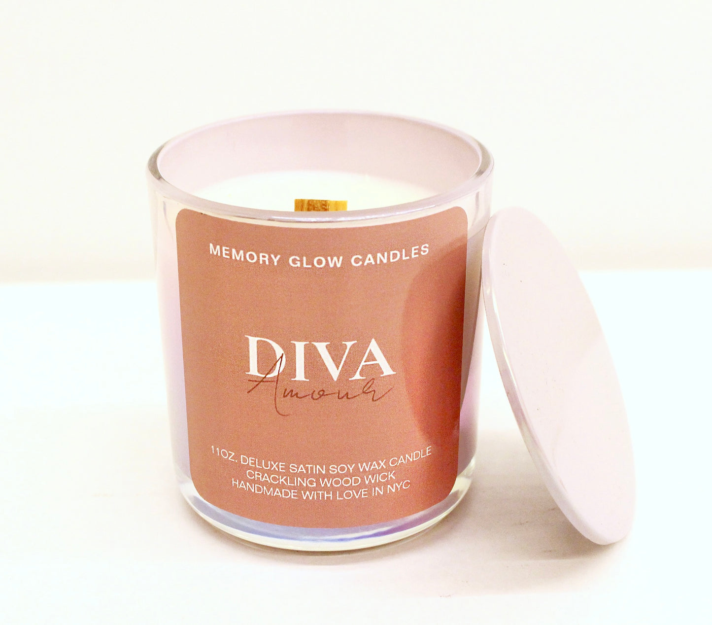 Indulge in a luxurious blend of Diva and Reign Memory Glow Candles. 11 oz. hand poured with long lasting soy wax, natural wood wick, and exquisite ingredients. Dedicated to those touched by Alzheimer's, we honor our matriarch's enduring spirit, which continues to inspire and guide us. Diva Amour: Clean, ozone, fruity green top notes with jasmine, lily of the valley, mid notes of lavender, bottom notes of wood, earth, and musk. Reign 540: Saffron, jasmine & crystal vanilla, balanced with rich suede, amber &