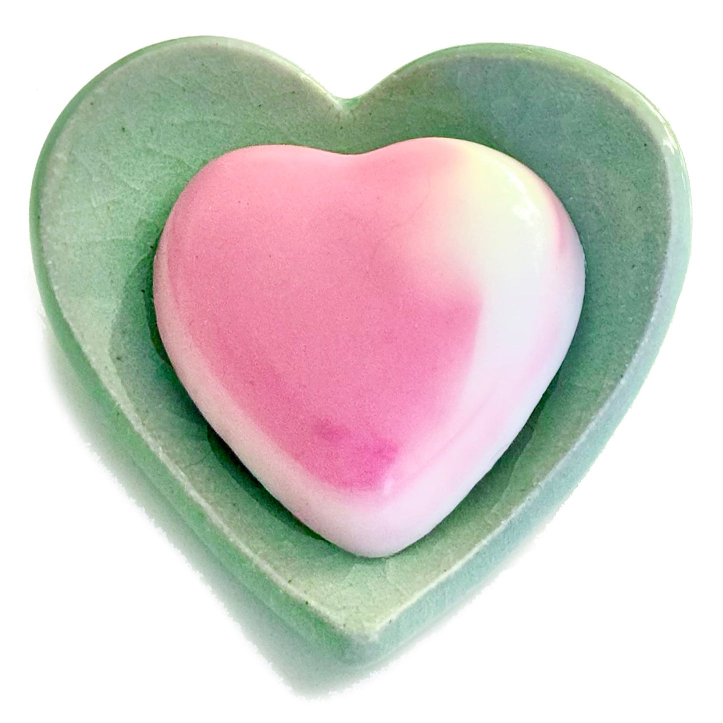 Hydrating Heart Soap https://www.handmadeonmarviasquare.com/products/hydrating-heart-soap Your skin will love the silky smooth feeling from these hydrating heart soaps by Patrice Angel Healing. Hand poured with Aloe vera and Mimosa scented shea butter. Each unique in design, so that no two soaps are alike. Dimensions: 3" x 3" Color: Rose & White Blend Handmade in California
