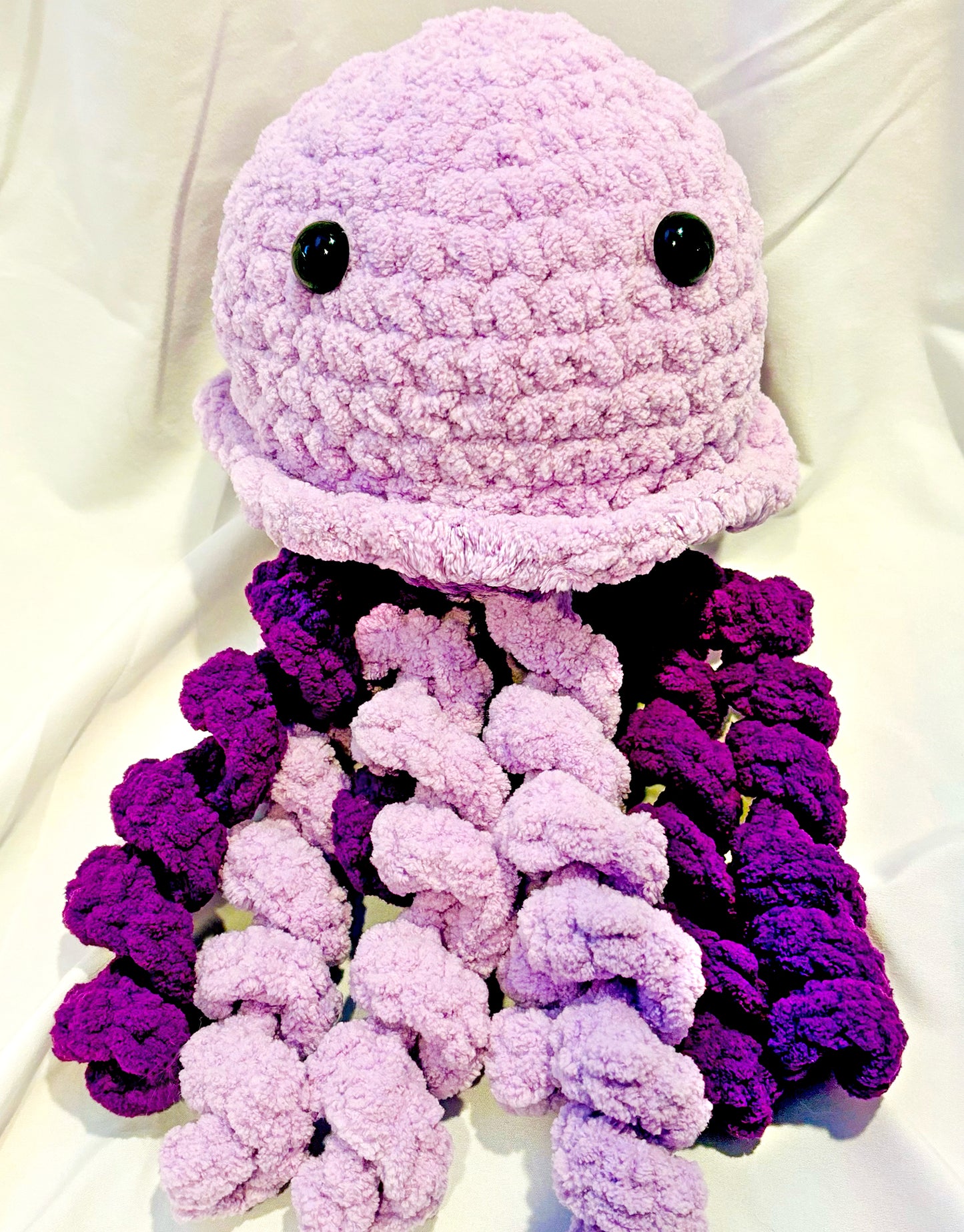 Adorable crochet Jellyfish plushie collectibles are hand crafted by Anya, MarVia Square's youngest artisan. Made with the softest acrylic yarn. If there is a specific color combination you would like, it can be custom made upon request. Dimensions: 6" wide, 12.5" high Hand wash or dry clean only Consciously made in California