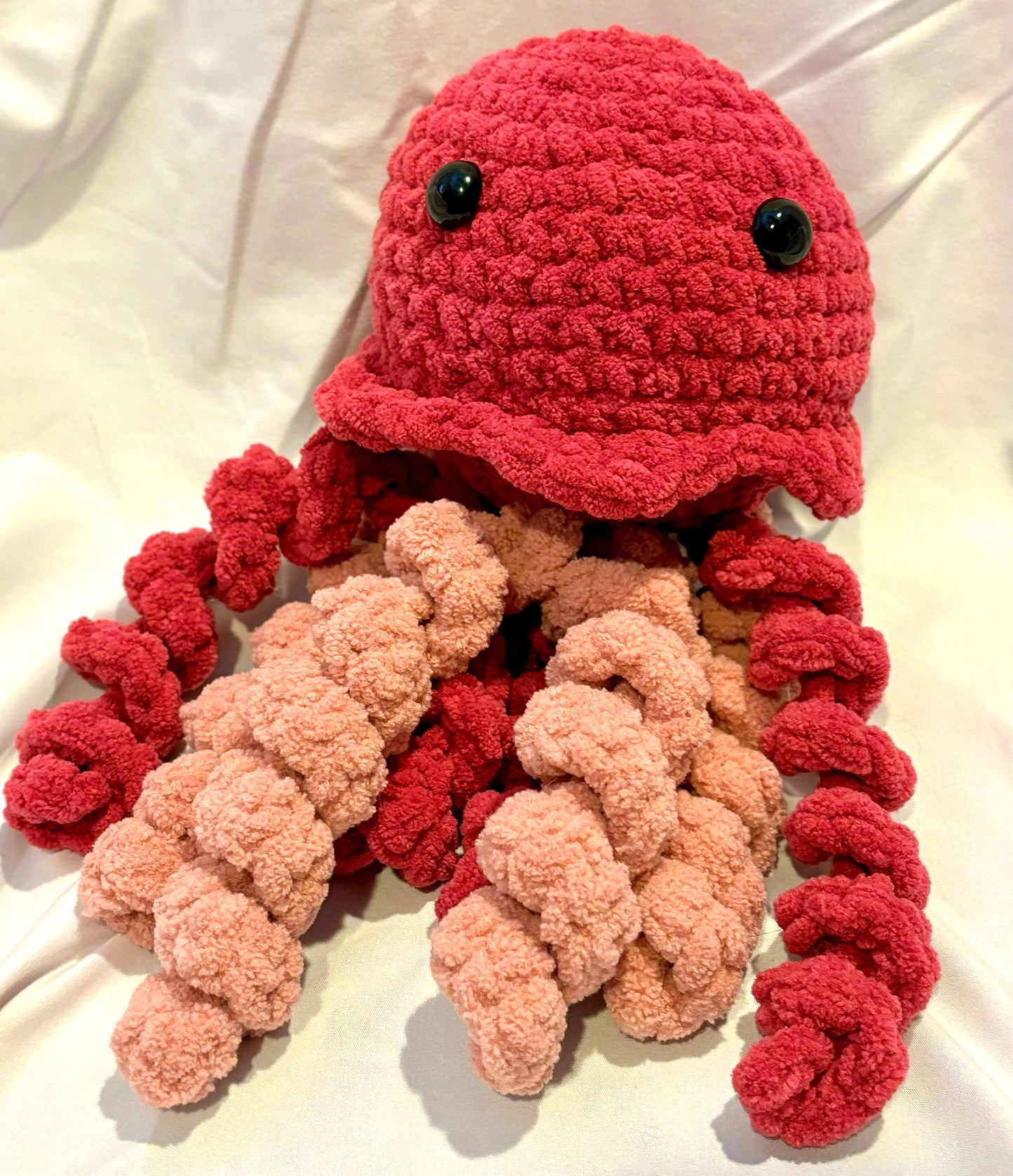Adorable crochet Jellyfish plushie collectibles are hand crafted by Anya, MarVia Square's youngest artisan. Made with the softest acrylic yarn. If there is a specific color combination you would like, it can be custom made upon request. Dimensions: 6" wide, 12.5" high Hand wash or dry clean only Consciously made in California