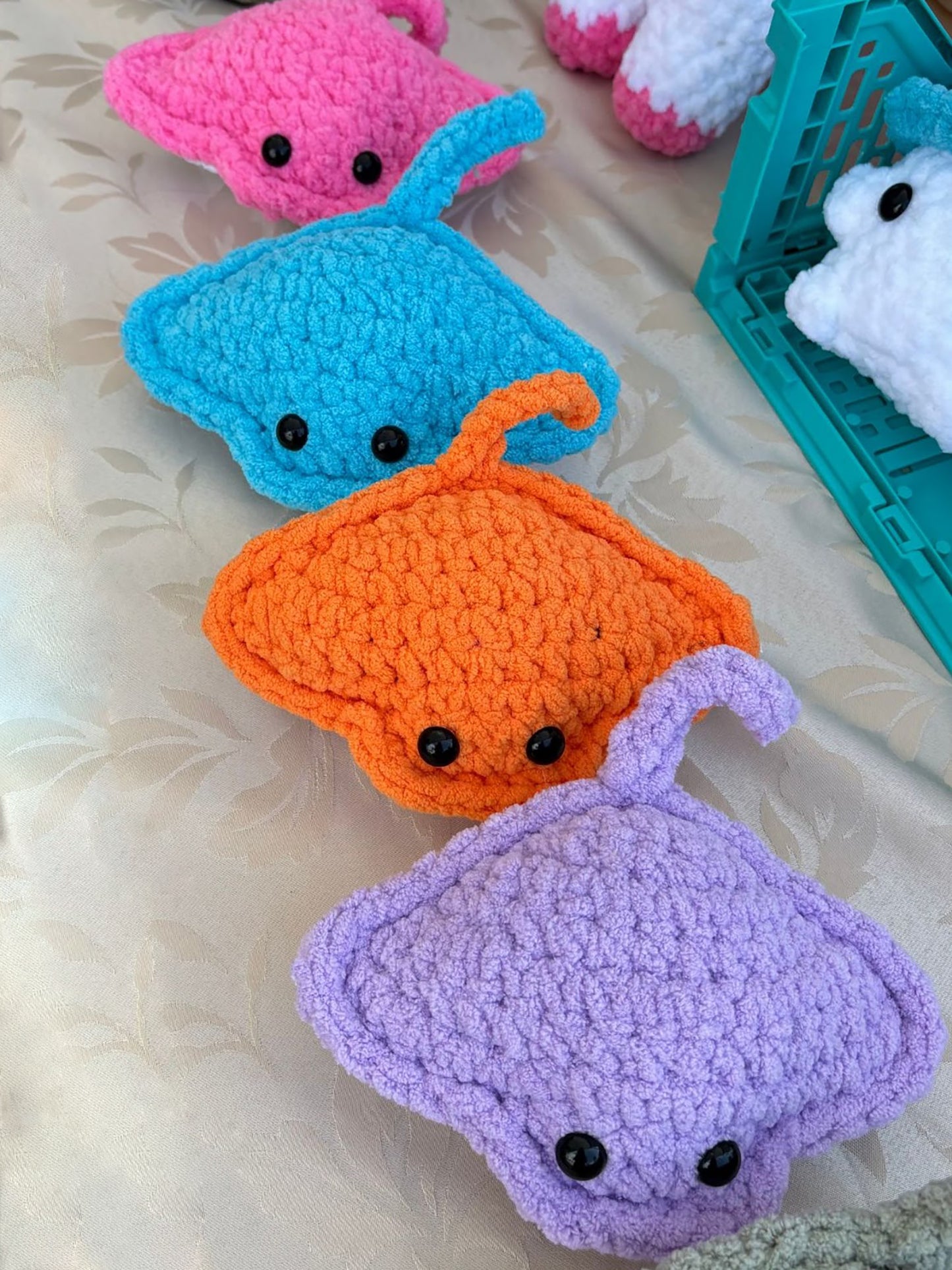 Sweet sea stingray, crochet plushie collectibles are handcrafted by Anya, MarVia Square's youngest artisan. Made with the softest, plush acrylic yarn, and black mushroom bead, plastic buttons for the eyes. Dimensions: 5.5" long, 7.5" wide Hand wash cold with mild soap or dry clean only Consciously made in California For Ages 3+
