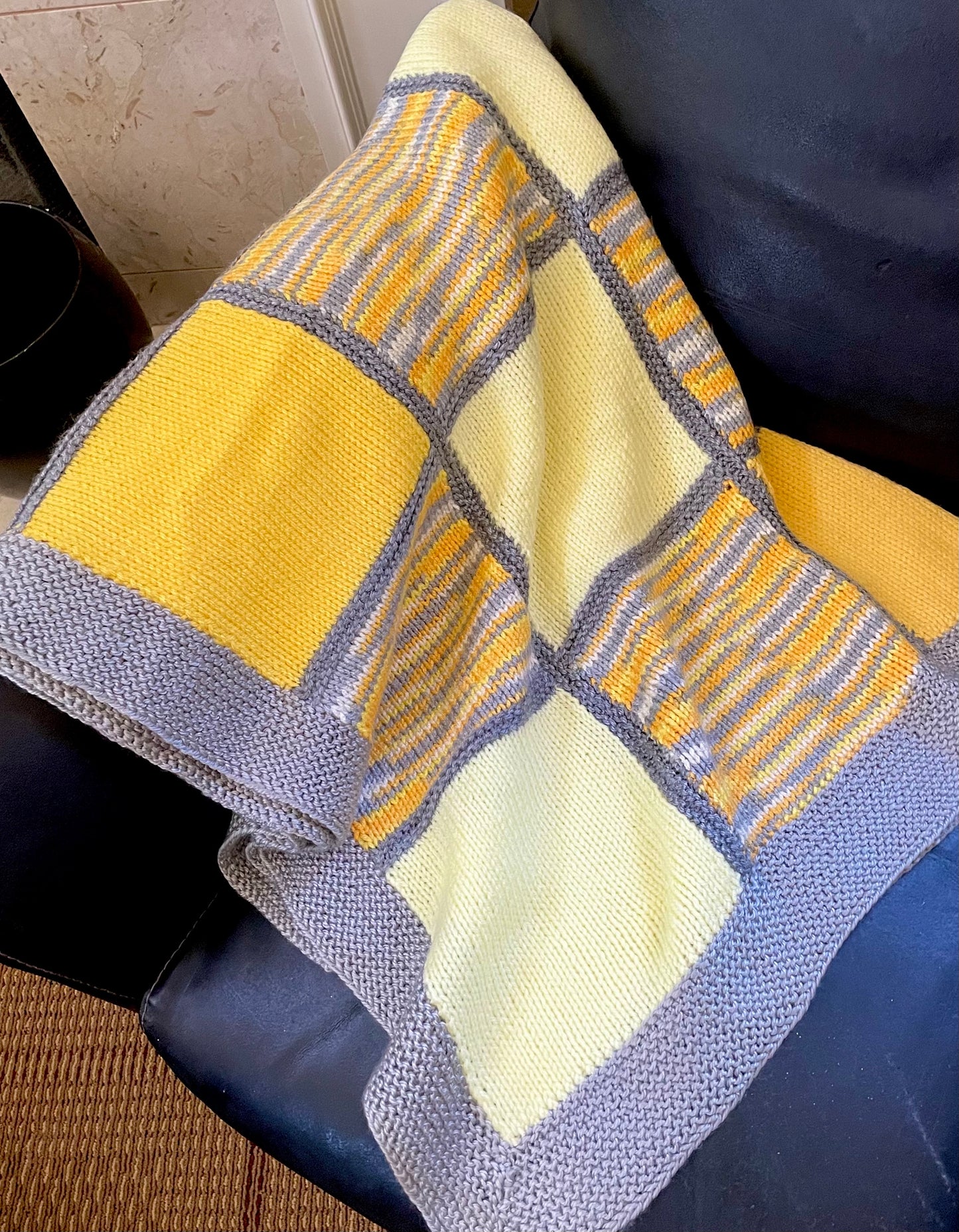 Oda's hand knit, quilt style blankets have impeccable attention to detail with different knit patterns in each square. Made from soft, up-cycled cotton/acrylic blend yarns, these beautiful one-of-a-kind pieces can also be custom made. Send us a message with your preferred color preferences (choice of 2 to 5 colors), size preference (see 'dimensions' below), then within 3 - 5 weeks your custom made blanket will be completed. Soft cotton/acrylic blend yarn Made in the USA