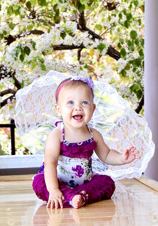 Best Selling colorful purple paisley-floral print on soft, light weight, cotton woven fabric. A-line halter top with delicate ruffle neckline, tie back, and soft elastic around the back to stay in place. Pair with the Gatsby Girl Capri pant for a comfy, flower fun look. 100% cotton woven Hand wash or machine wash delicate cycle, cold. Line dry. Sustainably made in California