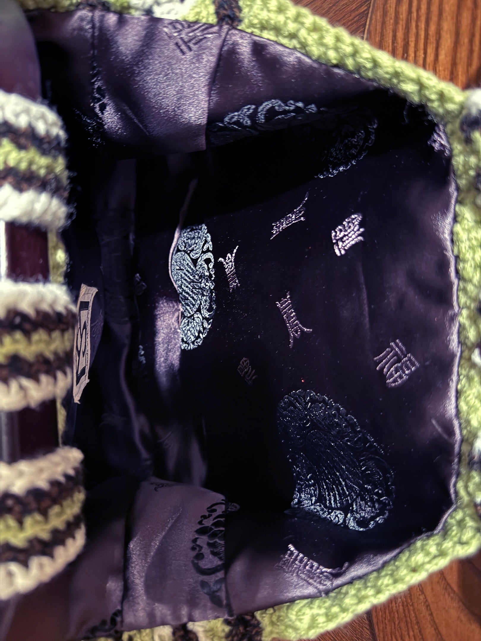 Bali's bamboo forests reflect in this crossbody style crochet bag by Oda G. Eco-conscious with up-cycled, cotton blend yarn in sage, cream and espresso, and fully lined with espresso satin fabric. Dark wood handles, and 20" strap that can be conveniently tucked inside the bag. Can be special ordered in a larger size and or color preference, if yarn color is available. Please email us your request and when the design is approved, and deposit is made, (depending on the size requested), allow up to 2 weeks.