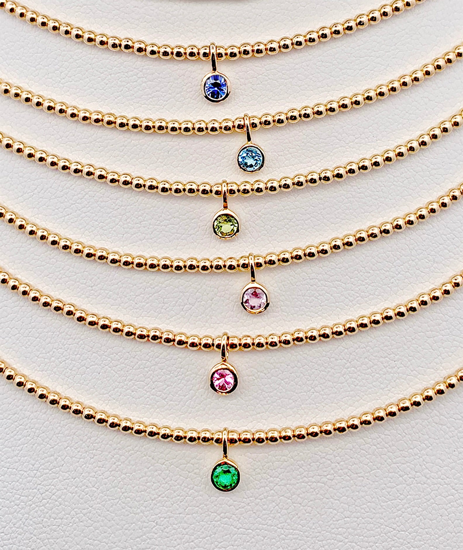 Gorgeous bezel set gemstone necklaces made with 14K gold-filled beads and 3/16" 14K bezel center gemstones made by Sayble Creations. Hand strung on nylon coated stainless steel beading wire with 14K gold-filled lobster clasp and 2" extender chain. Dimensions: 15" - 17" length Consciously made in California