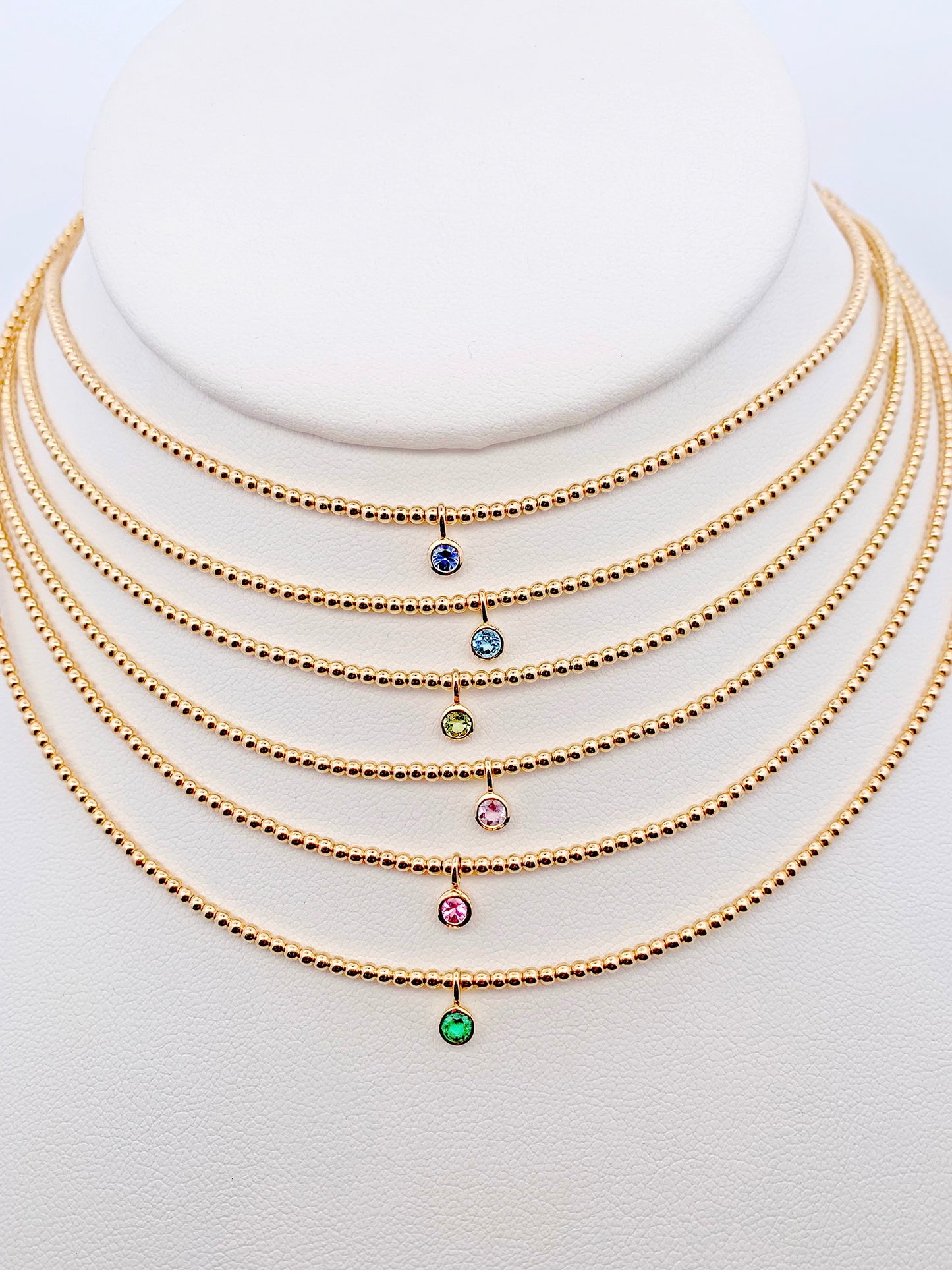 Gorgeous bezel set gemstone necklaces made with 14K gold-filled beads and 3/16" 14K bezel center gemstones made by Sayble Creations. Hand strung on nylon coated stainless steel beading wire with 14K gold-filled lobster clasp and 2" extender chain. Dimensions: 15" - 17" length Consciously made in California