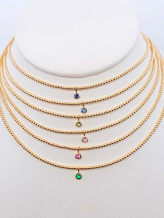 Gorgeous bezel set gemstone necklaces made with 14K gold-filled beads and 3/16" 14K bezel center gemstones made by Sayble Creations. Hand strung on nylon coated stainless steel beading wire with 14K gold-filled lobster clasp and 2" extender chain. Dimensions: 15" - 17" length Consciously made in California