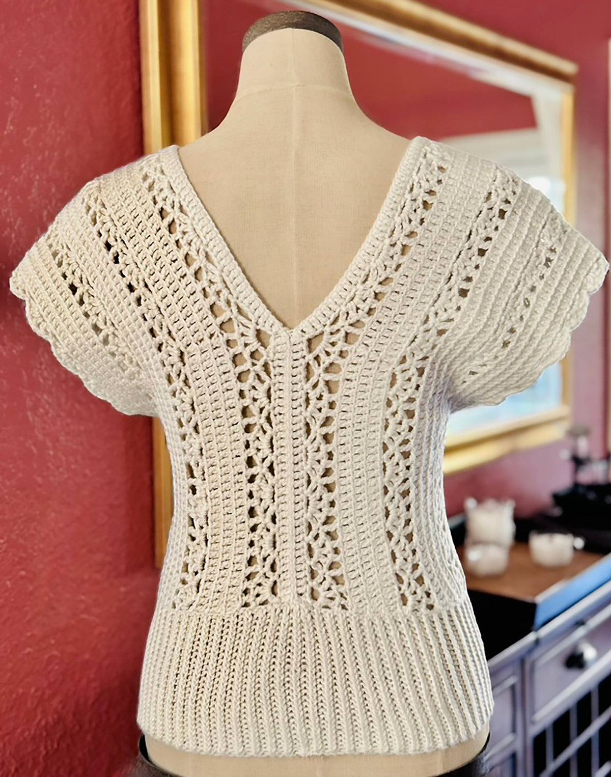 Italian inspired, the Murano crochet top is a timeless piece that can go from casual day to evening glam. Open stitch design with V neck (front & back) and scalloped edge short sleeves draping the shoulders. Made with upcycled cotton/acrylic blend yarn in ivory and impeccable craftsmanship by Oda G., this boho chic eye-catcher is a perfect addition to your wardrobe. Size: Small/Med., Length: 23" Hand Wash Cold or Dry Clean Consciously made in California