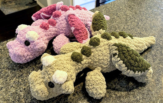 Fun Flying Dragon crochet plushie collectibles are handcrafted by MarVia Square's youngest artisan, Anya. Made with soft, plush acrylic yarn, and black mushroom bead, plastic buttons added for eyes. Dimensions: 16" long, 7.5" wide Spot treat with mild soap or dry clean Consciously made in California Ages 3+