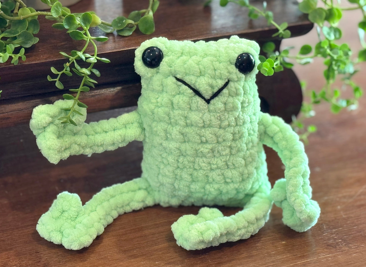 friendly fun frogs! These cute crochet plushie collectibles are handcrafted by Anya, MarVia Square's youngest artisan. Made with the softest, plush acrylic yarn, and black plastic, mushroom bead buttons for the eyes. Dimensions: Body: 5" high, 3.5" wide, Arms & Legs: 3.5" long Hand wash cold with mild soap or dry clean only Consciously made in California For Ages 3+