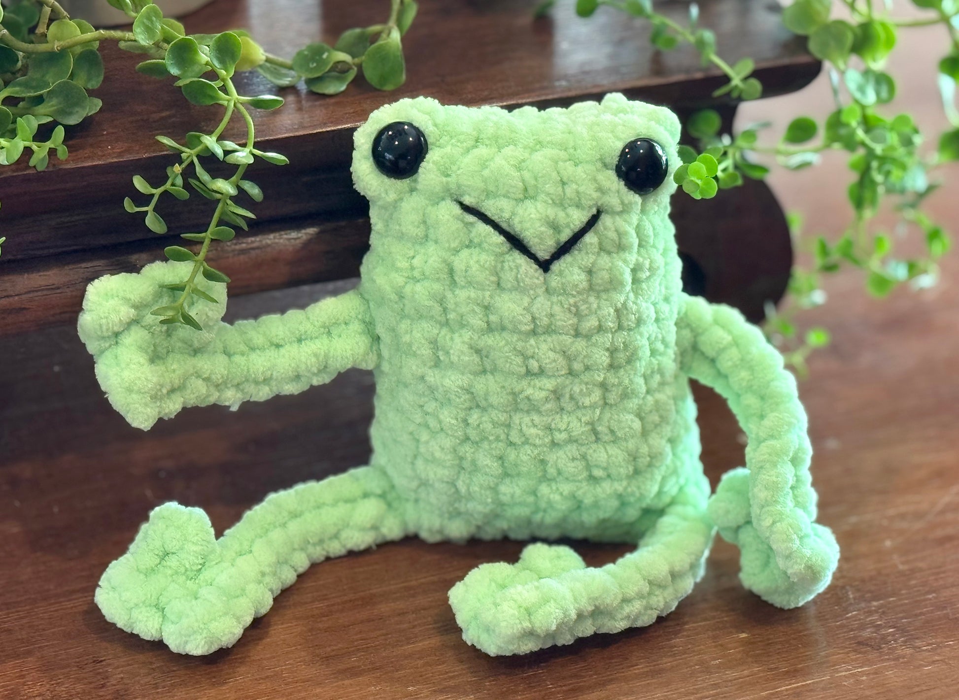 friendly fun frogs! These cute crochet plushie collectibles are handcrafted by Anya, MarVia Square's youngest artisan. Made with the softest, plush acrylic yarn, and black plastic, mushroom bead buttons for the eyes. Dimensions: Body: 5" high, 3.5" wide, Arms & Legs: 3.5" long Hand wash cold with mild soap or dry clean only Consciously made in California For Ages 3+