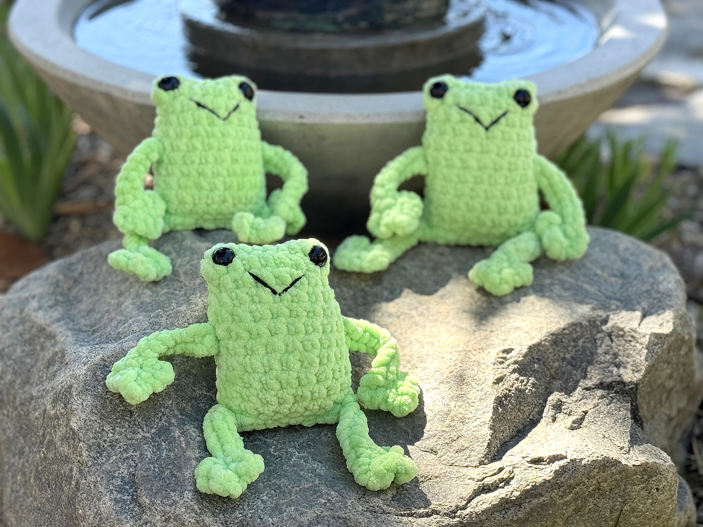 friendly fun frogs! These cute crochet plushie collectibles are handcrafted by Anya, MarVia Square's youngest artisan. Made with the softest, plush acrylic yarn, and black plastic, mushroom bead buttons for the eyes. Dimensions: Body: 5" high, 3.5" wide, Arms & Legs: 3.5" long Hand wash cold with mild soap or dry clean only Consciously made in California For Ages 3+
