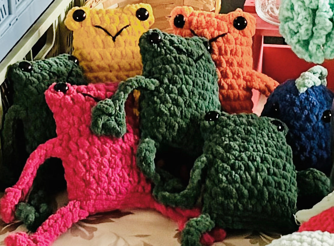 friendly fun frogs! These cute crochet plushie collectibles are handcrafted by Anya, MarVia Square's youngest artisan. Made with the softest, plush acrylic yarn, and black plastic, mushroom bead buttons for the eyes. Dimensions: Body: 5" high, 3.5" wide, Arms & Legs: 3.5" long Hand wash cold with mild soap or dry clean only Consciously made in California For Ages 3+