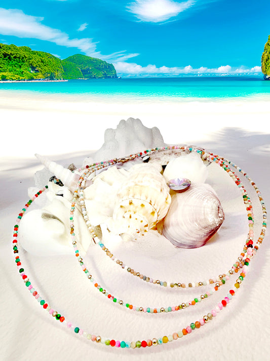 Elevate your summer essentials with gorgeous, multicolored, opal beaded necklaces. Handcrafted by Susan Sayble from her curated collection of Sayble Creations, each necklace is made with 14K gold filled beads, lobster clasp, and extender chain. Dimensions: 2.5mm beaded necklace: 15" length, 1.5" extender chain -OR- 2.0mm beaded necklace: 15" length, 1.5" extender chain Clean with polishing pad or soft cloth Consciously made in California