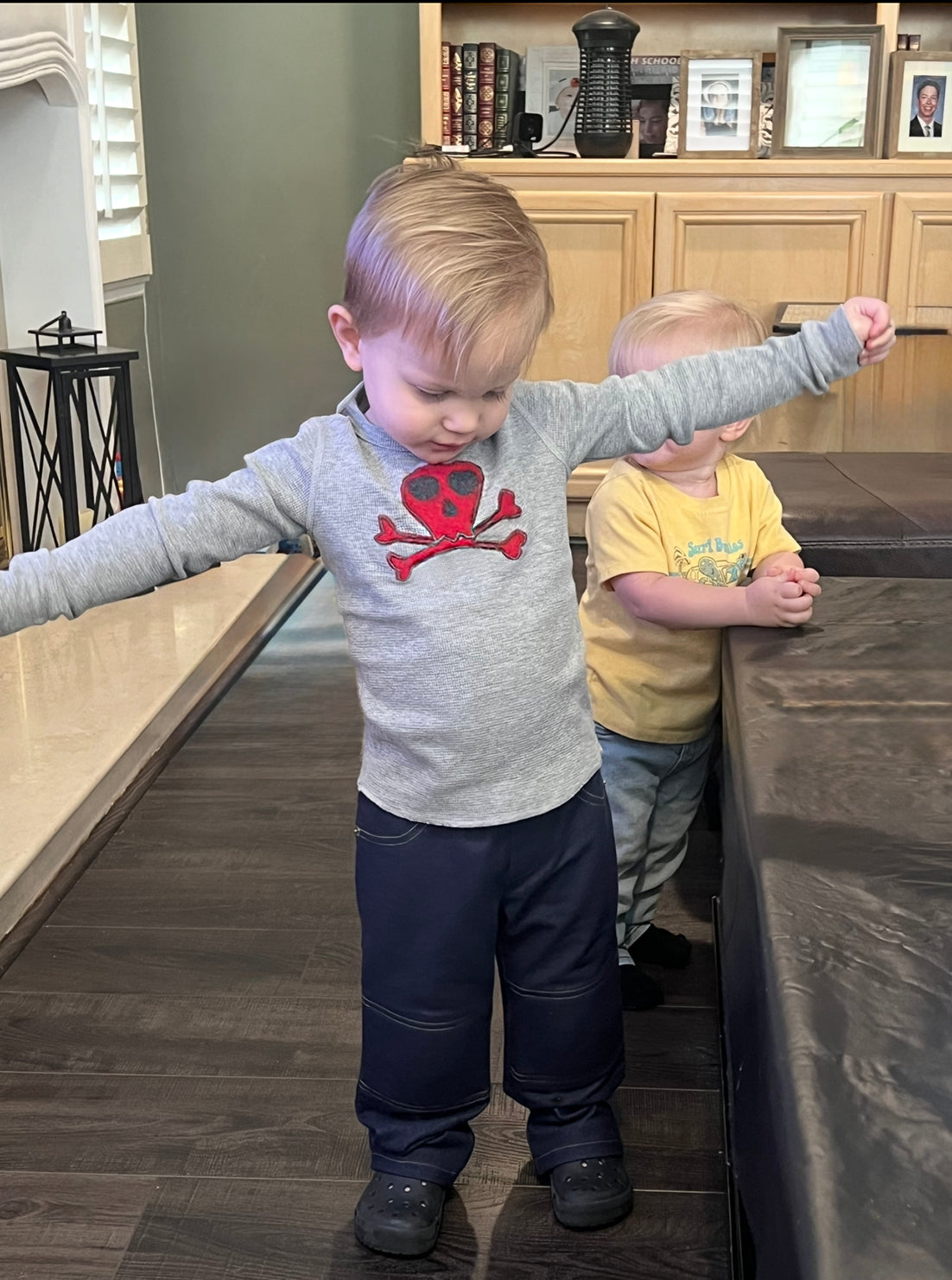 Arrr Matey! Your little pirate will love the red skull and crossbones applique in plush fleece on this soft, combed cotton, long-sleeve tee. Crew neck style for toddlers and lap shoulder design for infants. Infant sizes run slightly larger Machine wash cold (inside out), dry low heat Consciously made in the USA