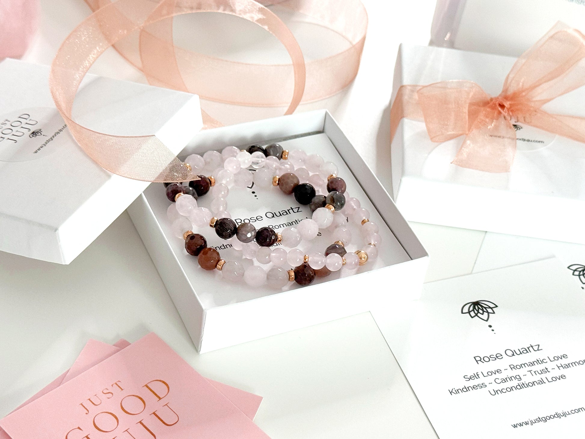 Feel good and look beautiful in 'Just Good JuJu' gemstone trio bracelets. The trio of Amazonite with sterling silver bead accents, has powerful healing properties, encouraging emotional balance, harmony, good luck and fortune. The trio of Rose Quartz and faceted petrified wood with 14k gold filled bead accents, has healing properties of calm, compassion and love. Each bracelet has stretch cord to fit most wrist sizes. Dimensions: Amazonite - (2) 8mm stones, silver bead accents, (1) 8mm stones with one 8mm s
