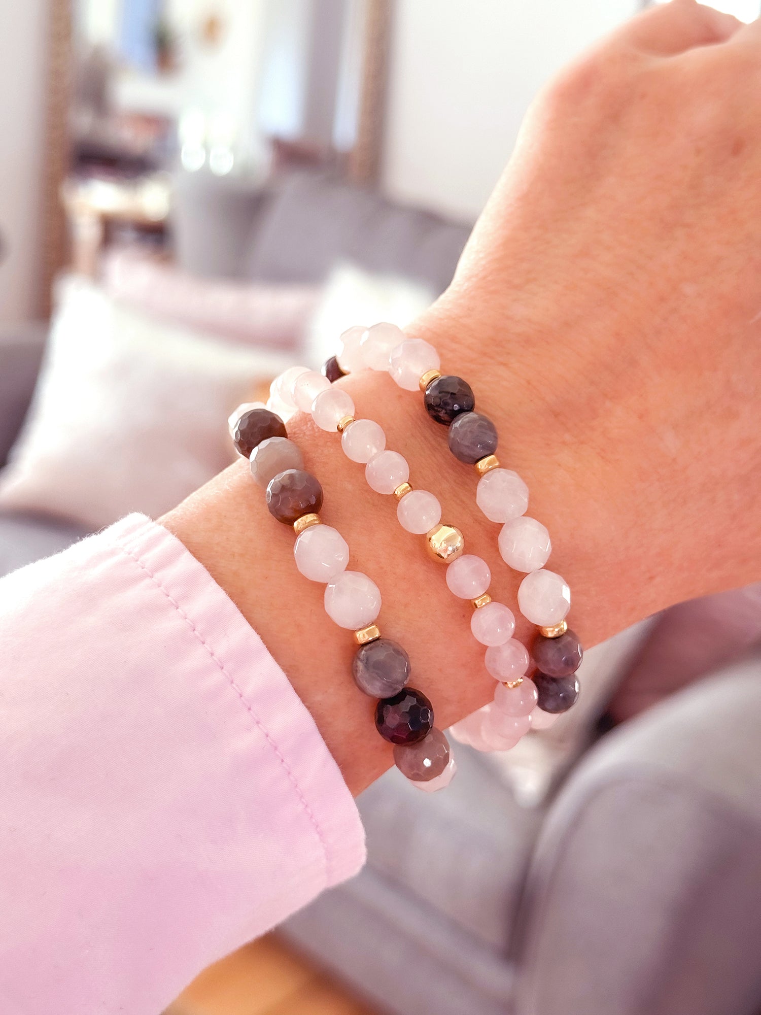Feel good and look beautiful in 'Just Good JuJu' gemstone trio bracelets. The trio of Amazonite with sterling silver bead accents, has powerful healing properties, encouraging emotional balance, harmony, good luck and fortune. The trio of Rose Quartz and faceted petrified wood with 14k gold filled bead accents, has healing properties of calm, compassion and love. Each bracelet has stretch cord to fit most wrist sizes. Dimensions: Amazonite - (2) 8mm stones, silver bead accents, (1) 8mm stones with one 8mm s