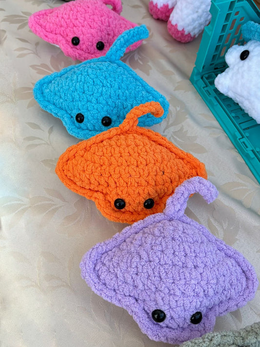 Sweet sea stingray, crochet plushie collectibles are handcrafted by Anya, MarVia Square's youngest artisan. Made with the softest, plush acrylic yarn, and black mushroom bead, plastic buttons for the eyes. Dimensions: 5.5" long, 7.5" wide Hand wash cold with mild soap or dry clean only Consciously made in California For Ages 3+