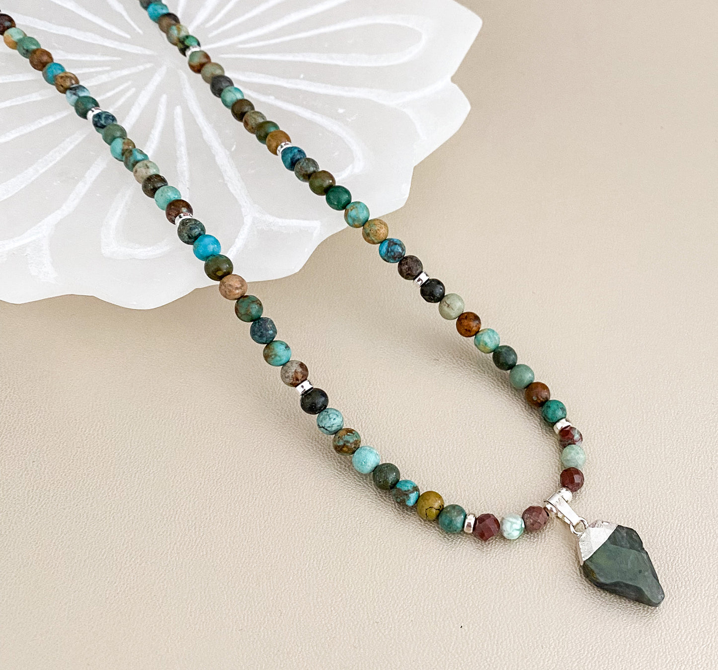 The TLC gemstone necklace has the perfect combination of energy to improve your overall well being. Turquoise will improve your memory, concentration, and optimism, Labradorite will heighten intuition and sharpen your focus, and Chrysocolla, 'the wise stone', will help you find resolutions with calm inspiration. Sterling silver accents and clasp with extension. Dimensions: 19.25" length with 4mm beads of natural turquoise, labradorite & faceted chrysocolla Consciously made in Arizona