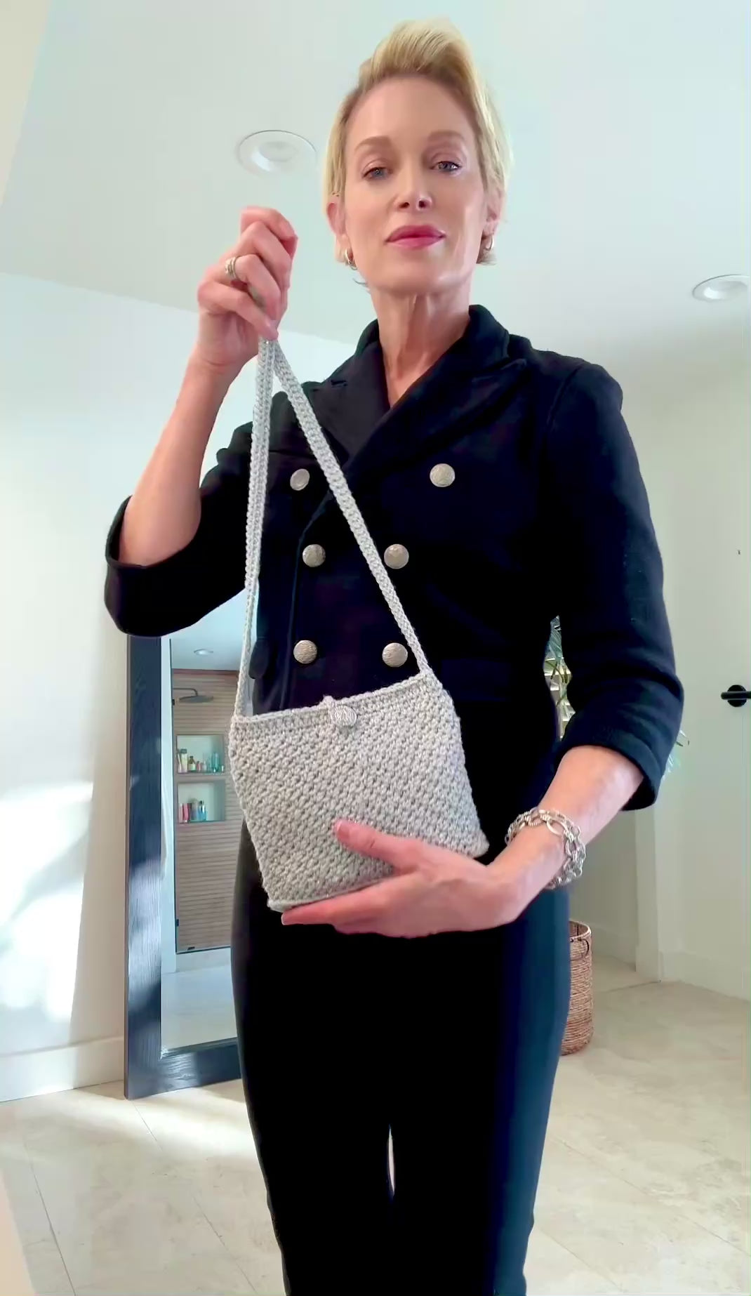 A perfect combination of sparkle and size with vintage style Mini Monaco and Classic Cannes crocheted bags. A favorite for a night out dancing. The Mini Monaco is lined with black satin fabric, hand beaded mesh with tiny colorful beads, beaded fringe on the bottom and beaded tassle at the end of the cross body strap. The Classic Cannes is unlined with a secure crochet pattern that insures better stretch if you need to add more in your bag. Up-cycled silver metallic acrylic yarn, vintage chrome button closur