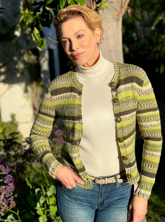 Soft shades of sage green in a beautiful variegated stripe pattern, makes this soft button-down, acrylic knit sweater with coconut buttons a perfect accessory on a chilly day. European style knit by Oda G. exclusively for MarVia Square. Hand wash cold, Line dry or Dry clean Handmade with love in the USA