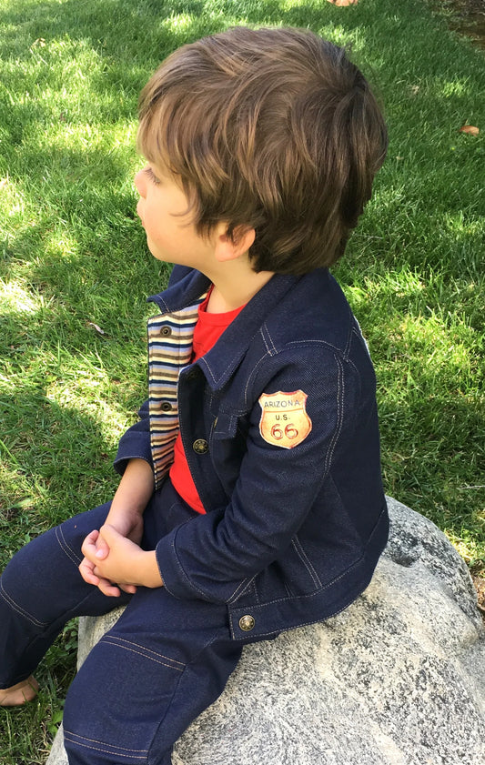 Your little explorer will be super comfy in our Route 66 denim knit jacket with cotton knit, stripe lining. Sleeves can easily be rolled up and secured with snaps on the cuff. Vintage print of Route 66 applique on the back and shoulder. Nickel free, antique bronze snap closures for easy on & off. Order one size larger for longer wear Machine washable, warm, delicate cycle Made in the Jammin' USA