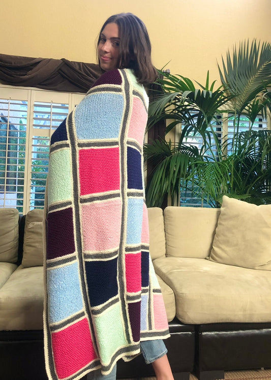 Oda's hand knit, quilt style blankets have impeccable attention to detail with different knit patterns in each square.  Made from soft, up-cycled cotton/acrylic blend yarns, these beautiful one-of-a-kind pieces can also be custom made.  Send us a message with your preferred color preferences (choice of 2 to 5 colors), size preference (see 'dimensions' below), then within 3 - 5 weeks your custom made blanket will be completed.       Soft cotton/acrylic blend yarn     Made in the USA