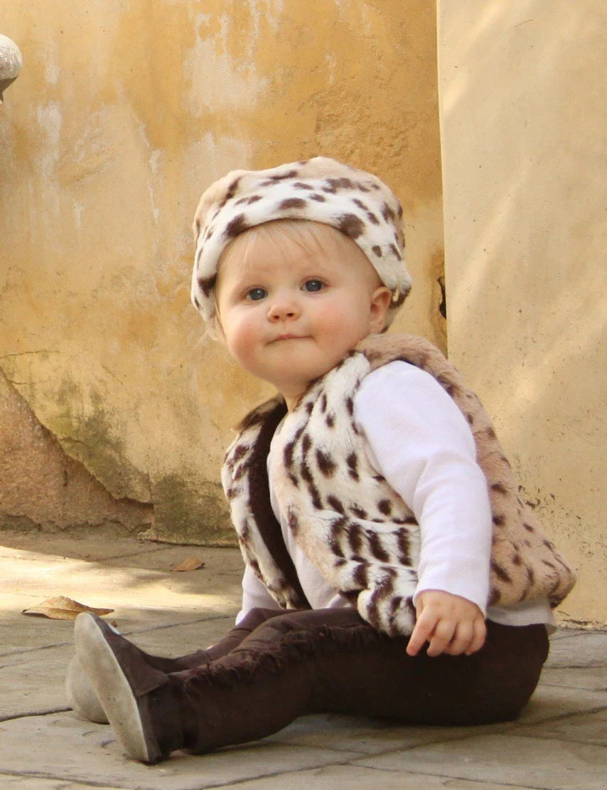 Oh so soft Reversible Leopard Cuddle Vests are the must haves for a little extra layer. Available in Brown Snow Leopard with solid dark brown on one side, white/cream/tan leopard print on the other. Black Snow Leopard has solid black with white/grey/black leopard print. Fabric covered hook and eye closures.